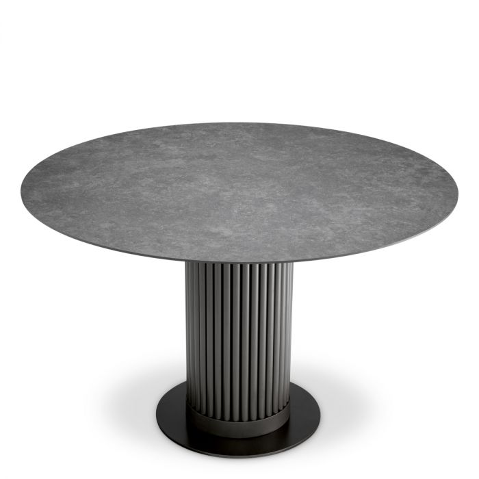 Mesa de comedor exterior Volterra redonda de cerámica gris con acabado bronce