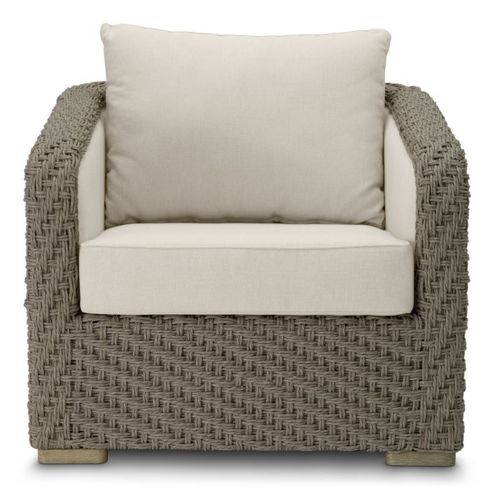 Silla de exterior Bryson de ratán sintético tejido en color arena viola
