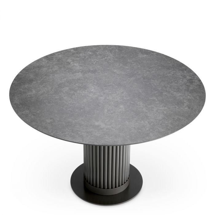 Mesa de comedor exterior Volterra redonda de cerámica gris con acabado bronce