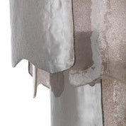 Lámpara de araña Asinara S con acabado en latón antiguo y cristal ahumado.