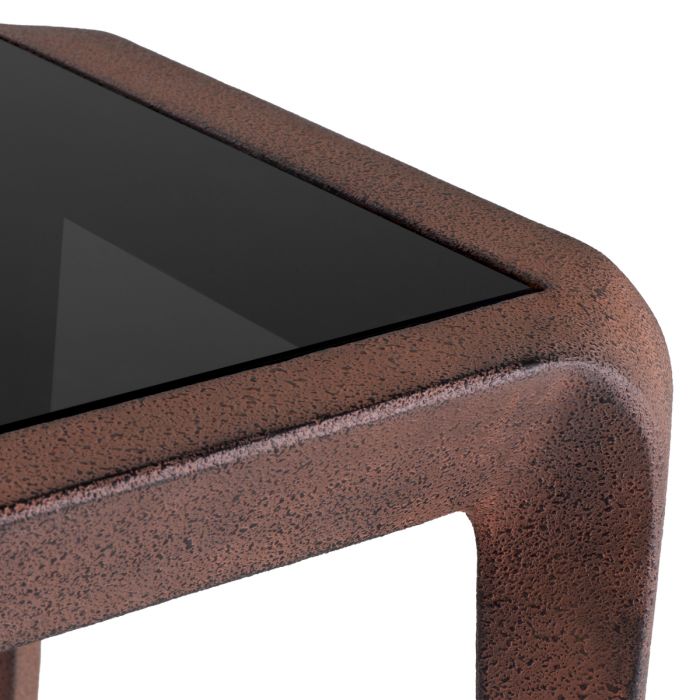 Mesa auxiliar Quentin de cristal negro con aspecto oxidado